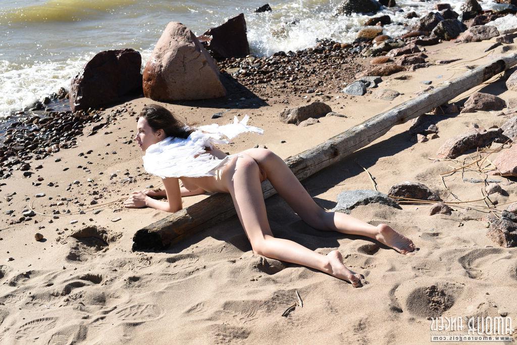 20P Brunette teen Dama spreads her wings and legs outside