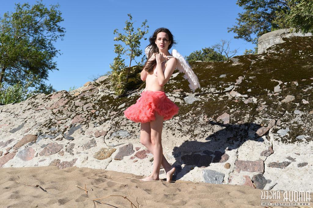 20P Brunette teen Dama spreads her wings and legs outside