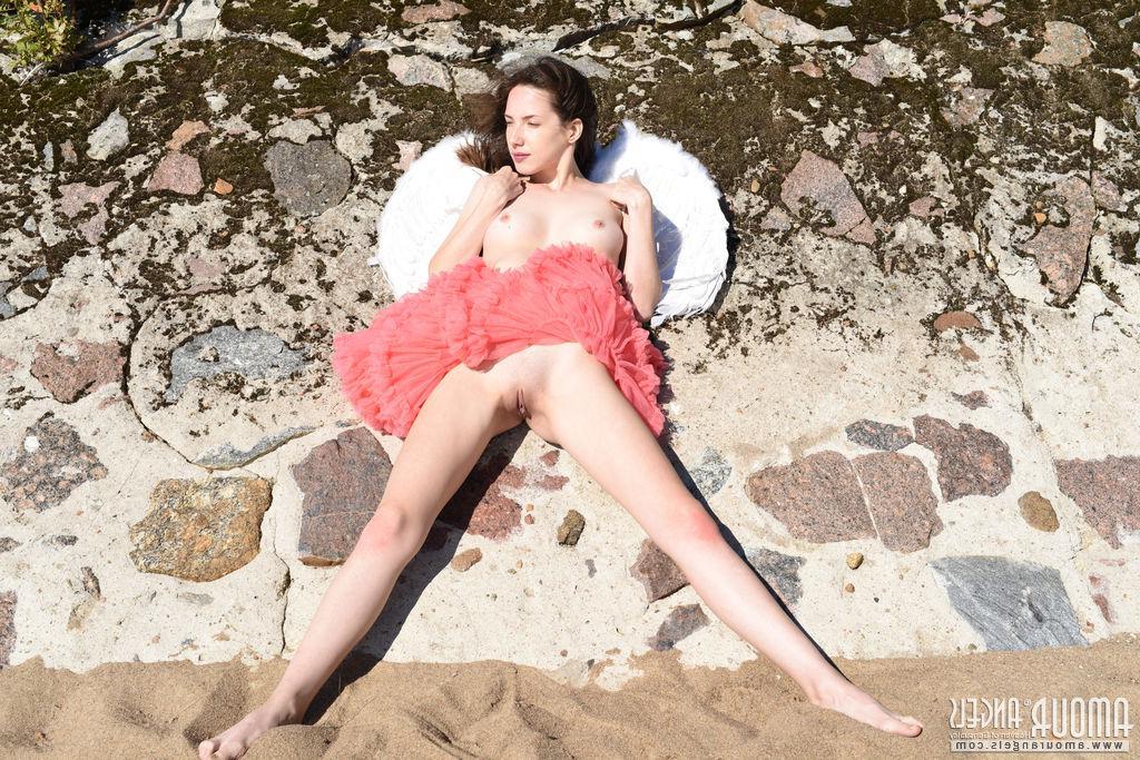 20P Brunette teen Dama spreads her wings and legs outside