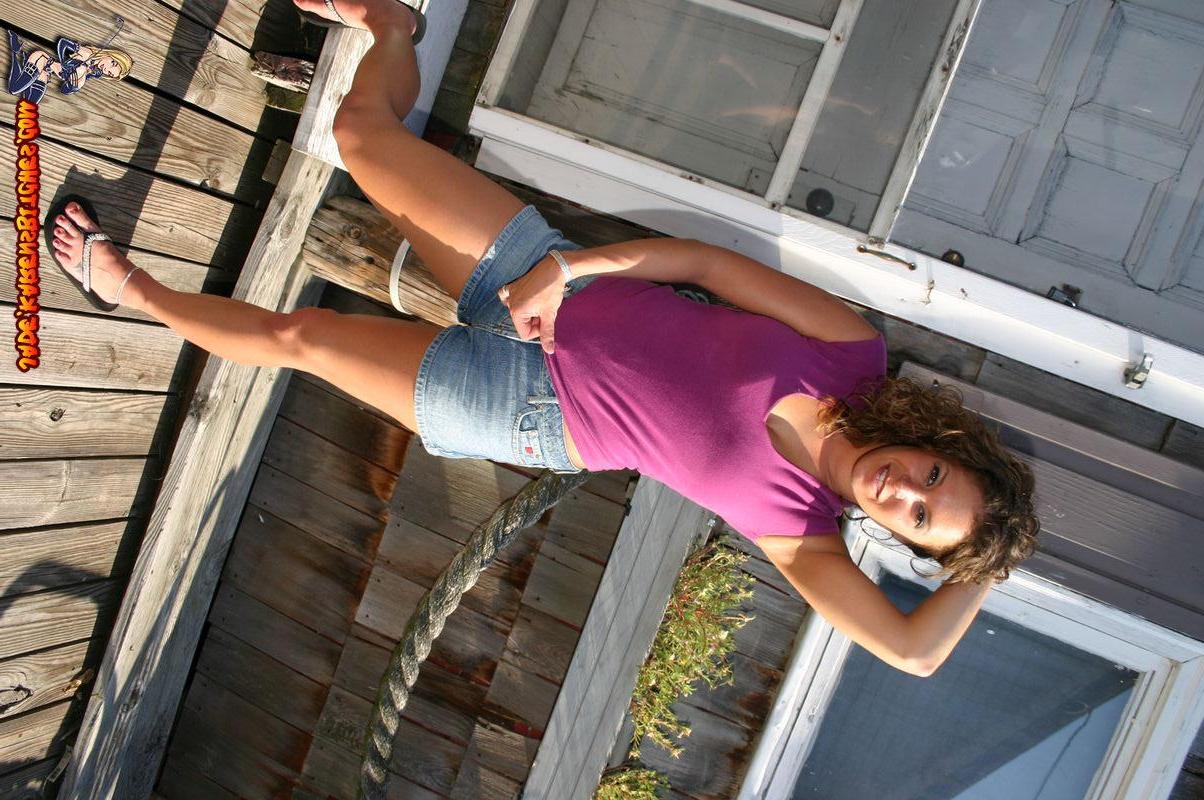 20P Pictures of a coed showing off her hot legs outside