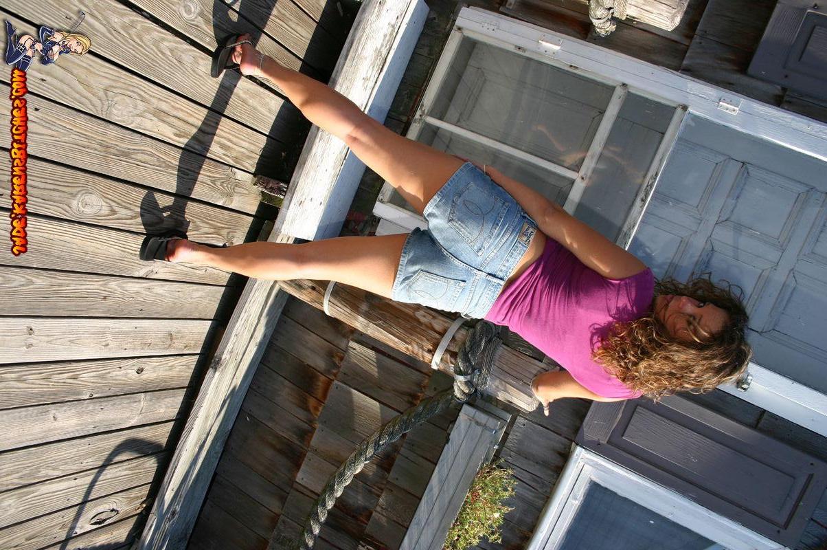 20P Pictures of a coed showing off her hot legs outside