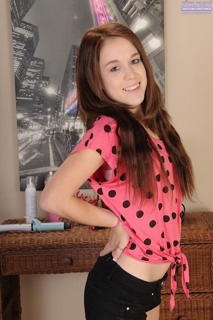 15P Redhead coed strips completely naked and shows you her tight pussy