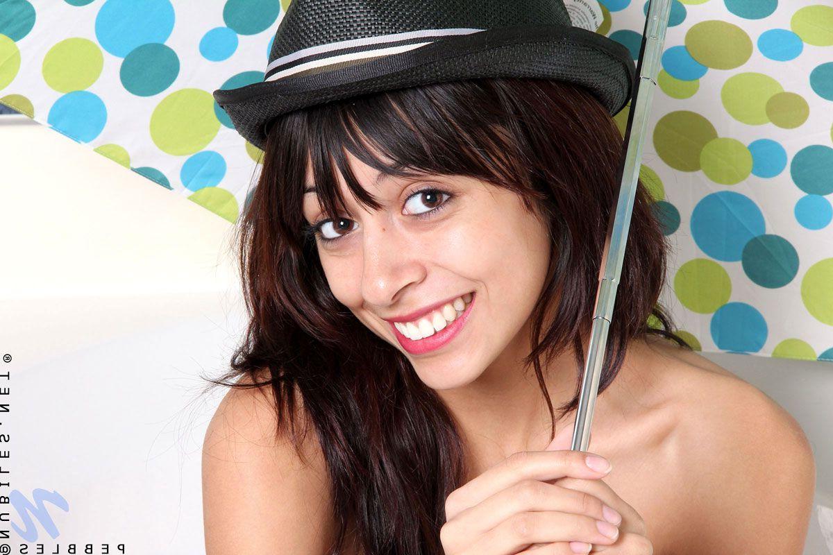 15P Pictures of teen girl Pebbles getting her pussy wet