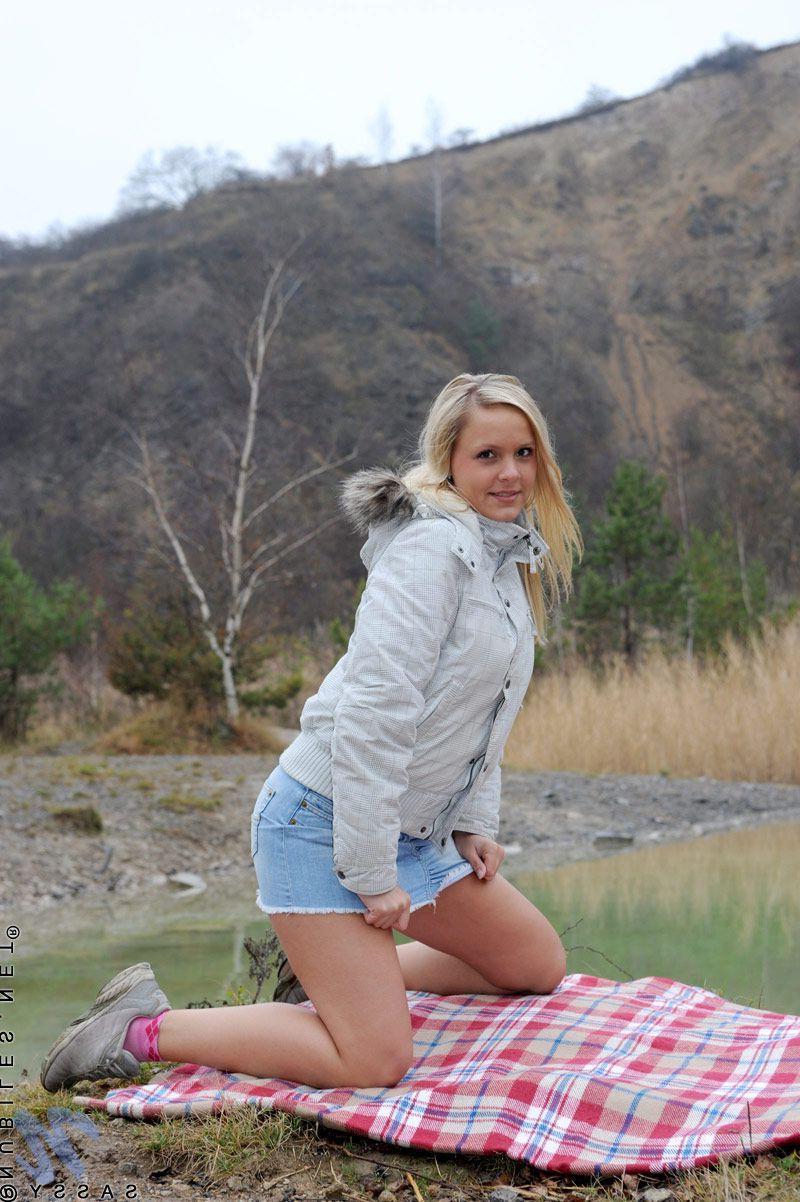 20P Pictures of blond teen Sassy rubbing her clit outside