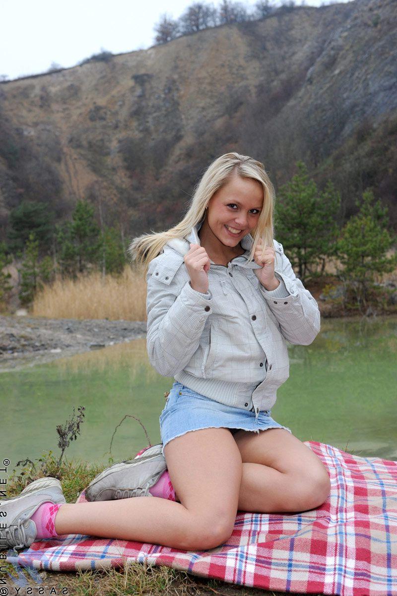 20P Pictures of blond teen Sassy rubbing her clit outside