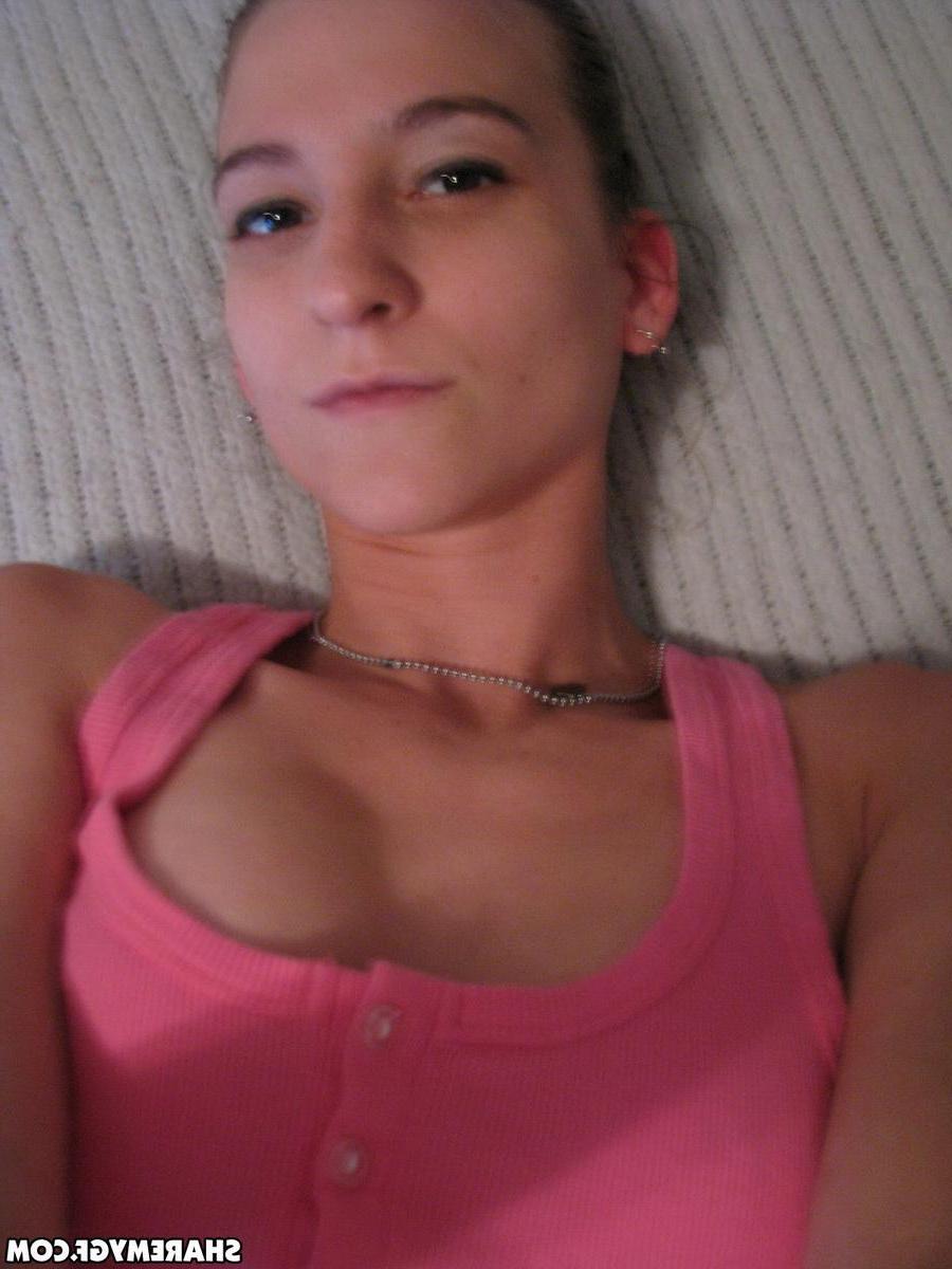 12P Naughty brunette coed flashes her tight pussy in bed