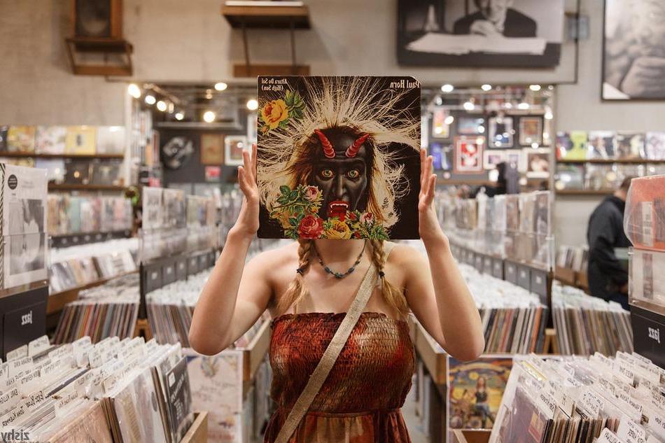 8P Hot coed Hilary Craig flashes her boobs and panties in a record store