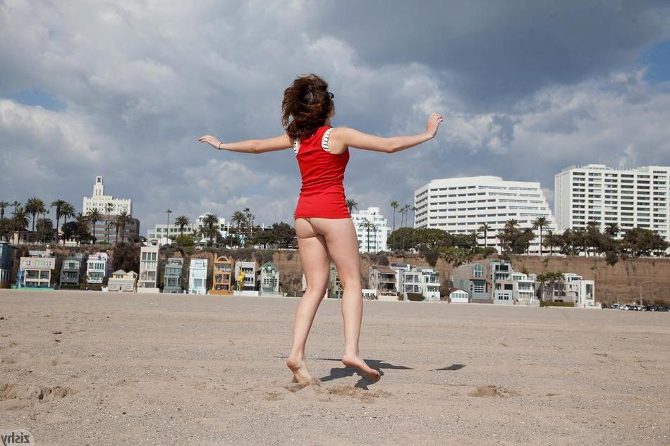 8P Brunette coed Vivian Campbell teases outside on the beach