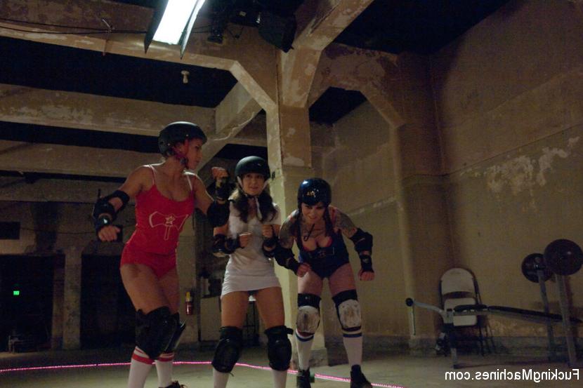 15P In the distance, Angel Dust (Remy LaCroix) stands in the middle of the rink, a s
