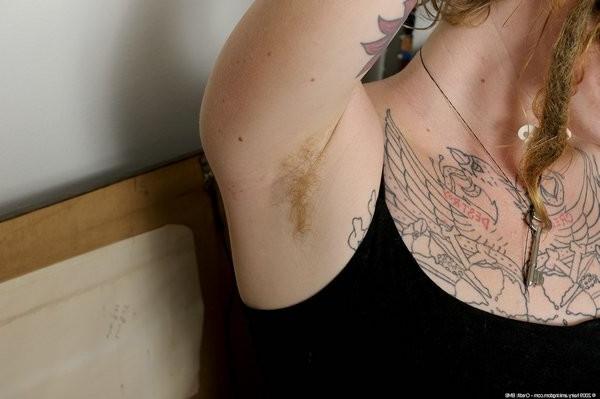 15P Tattooed redhead Grace spreads her hairy pussy open