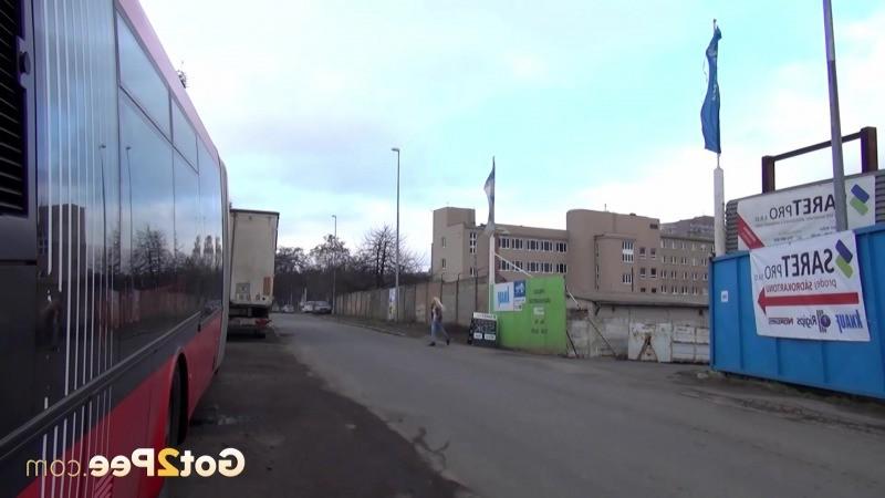 15P Sexy blonde girl pisses between parked buses