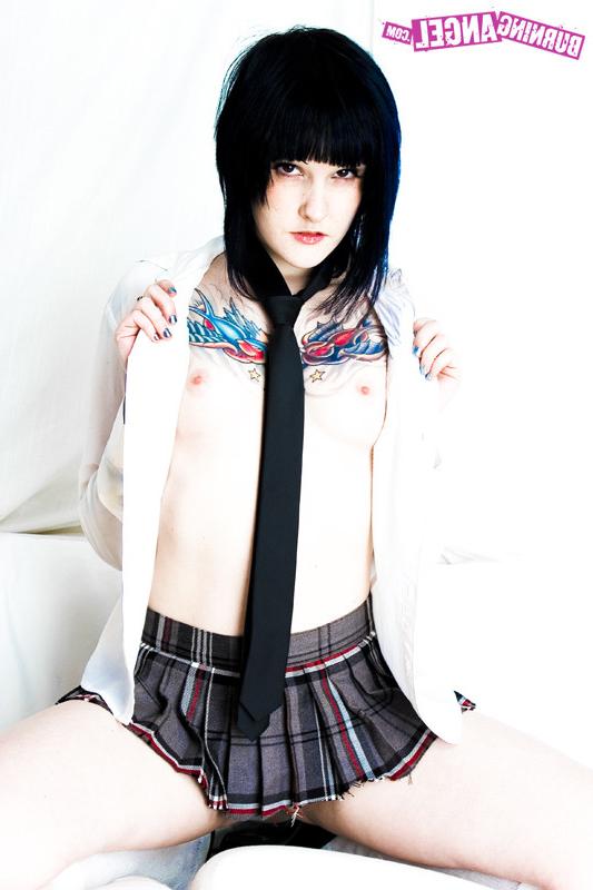 15P Tattooed girl in school girl uniform gets naked
