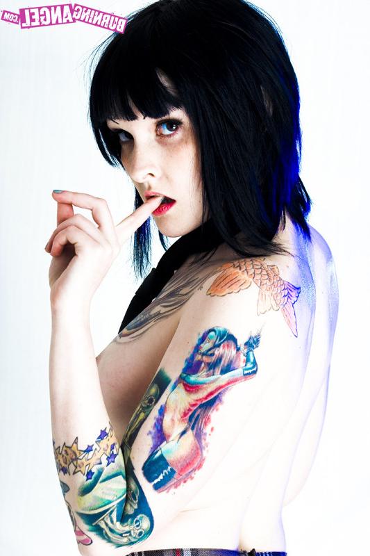 15P Tattooed girl in school girl uniform gets naked
