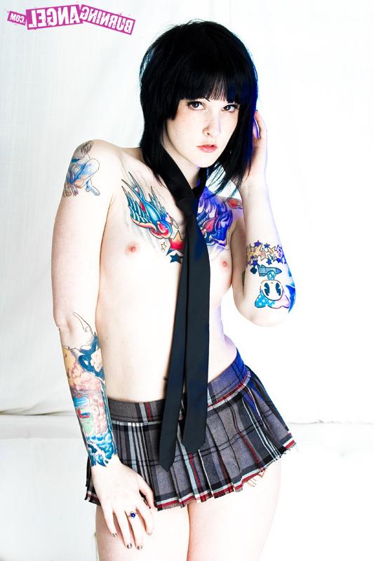 15P Tattooed girl in school girl uniform gets naked
