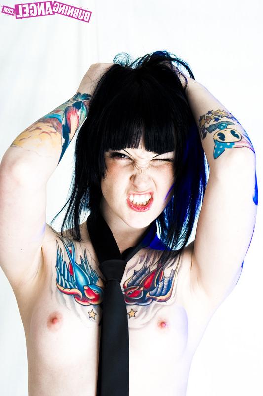 15P Tattooed girl in school girl uniform gets naked