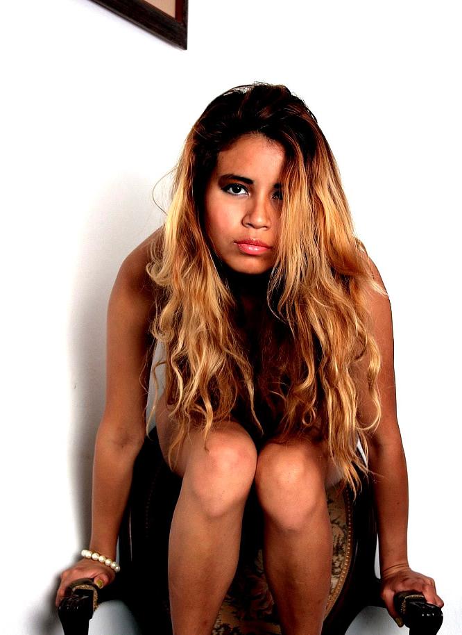 15P Delectable Latina teen stripping out of skimpy shorts