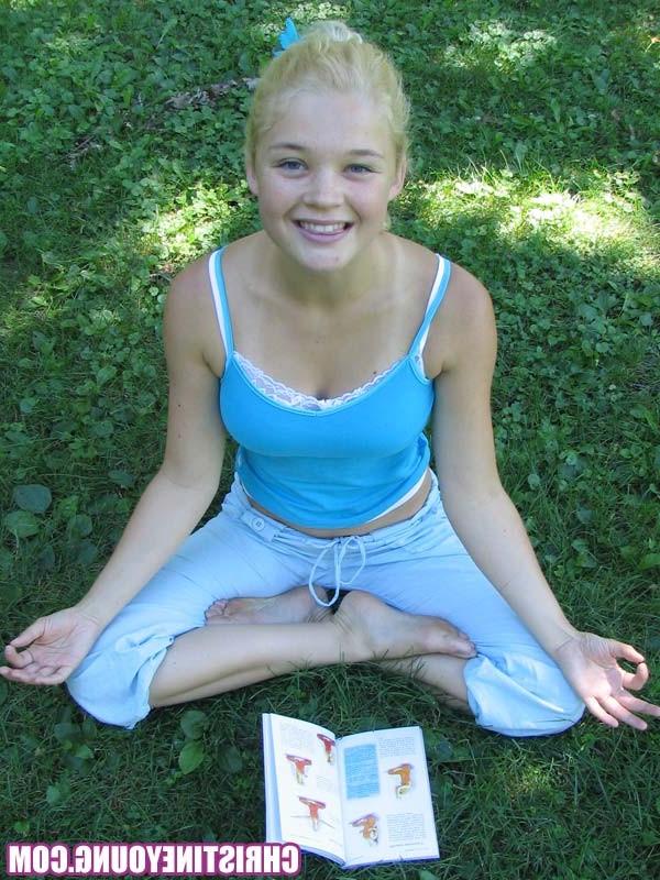 14P Pretty blonde teen girl Christine Young posing in a park