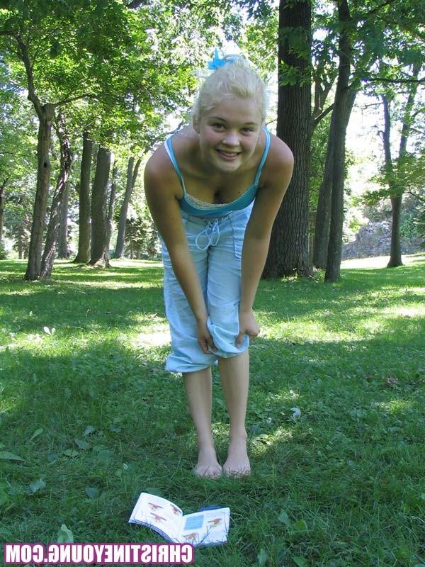 14P Pretty blonde teen girl Christine Young posing in a park