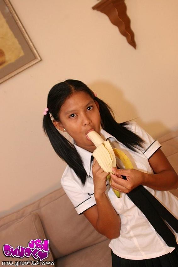 20P Cute Kat Young strips wearing a School Girl Uniform