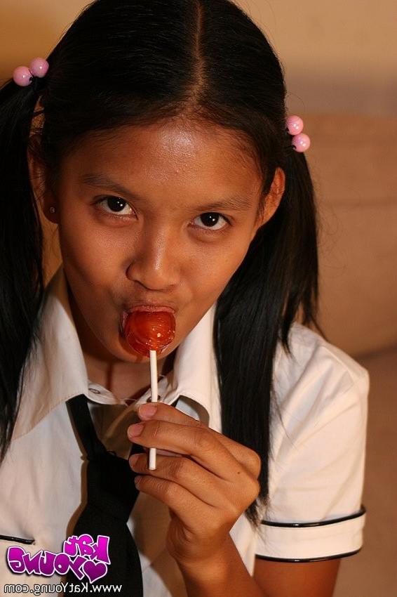 20P Cute Kat Young strips wearing a School Girl Uniform