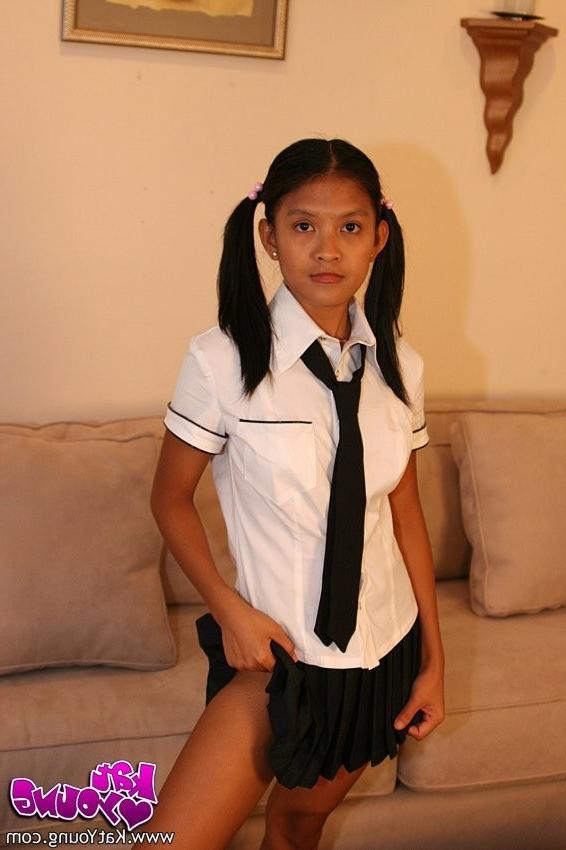 20P Cute Kat Young strips wearing a School Girl Uniform