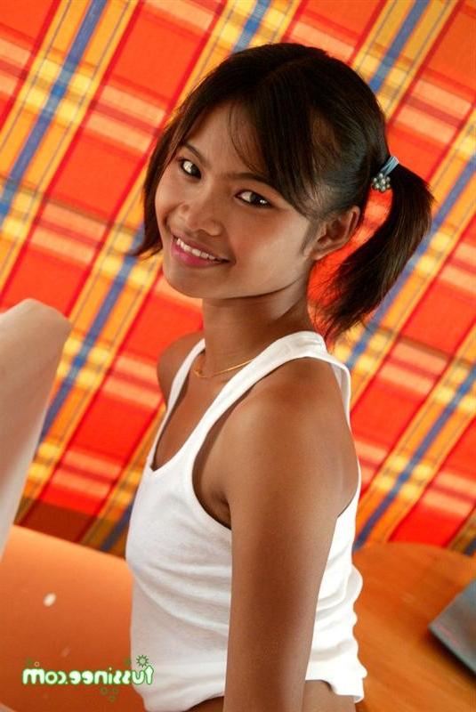 15P Petite teenager Tussinee in pigtails posing in a wet t-shirt
