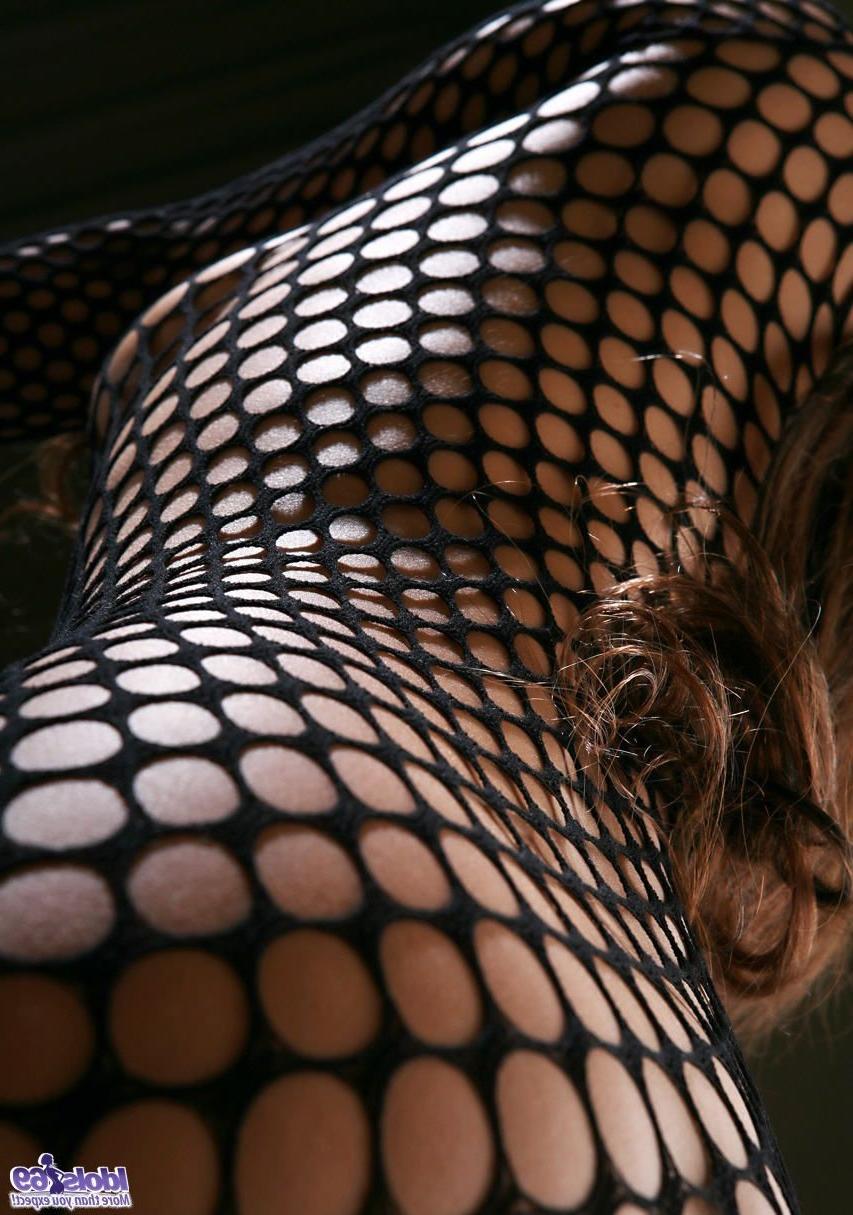 15P A skinny Japanese woman in a fishnet body stocking