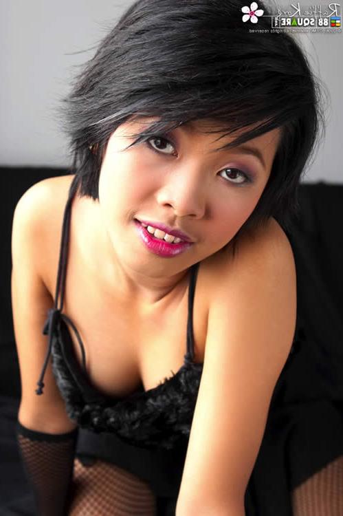 15P Asian hottie wearing fishnet stockings