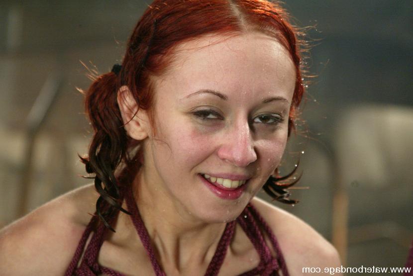 15P Petite redhead Sabrina Sparx is dominated by latex-clad beauty