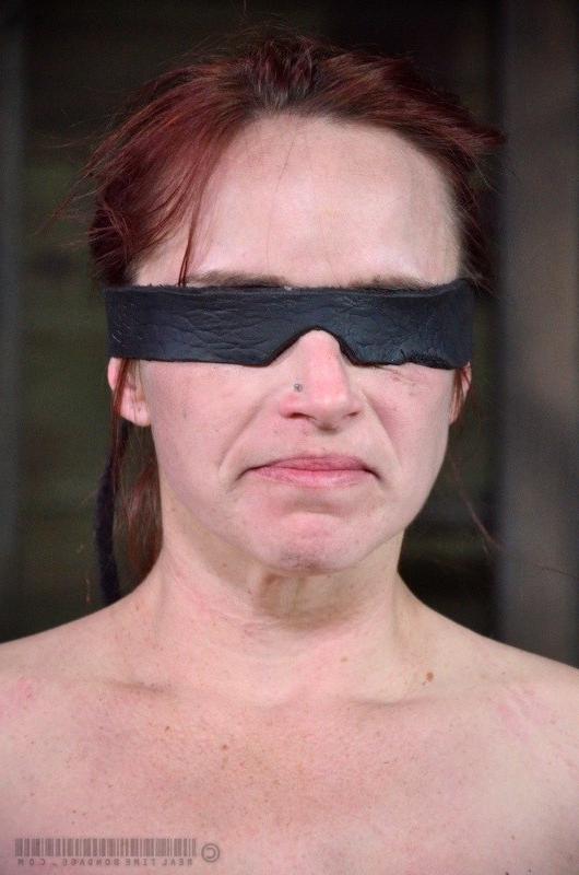 16P Bella Rossi is bound and blindfolded with bdsm toys all over her body