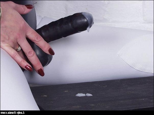 16P BDSM Mistress with a strap-on posing