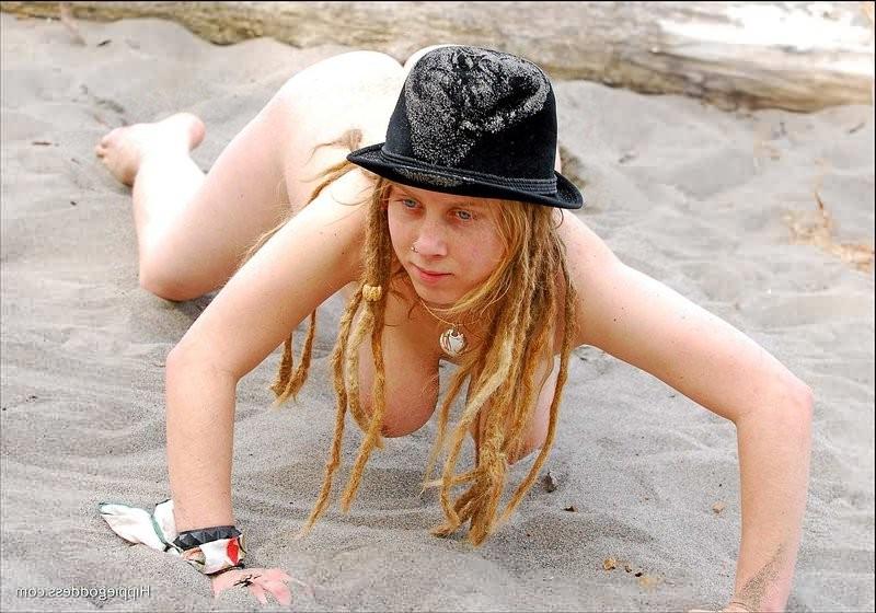 16P Awesomely busty nudist bares blonde pussy at beach