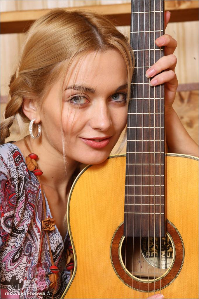 12P Gorgeous Russian teen Sweet Lilya strips and plays guitar naked