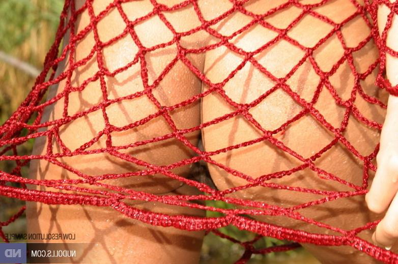 15P Teen wears red fishnet outdoor...