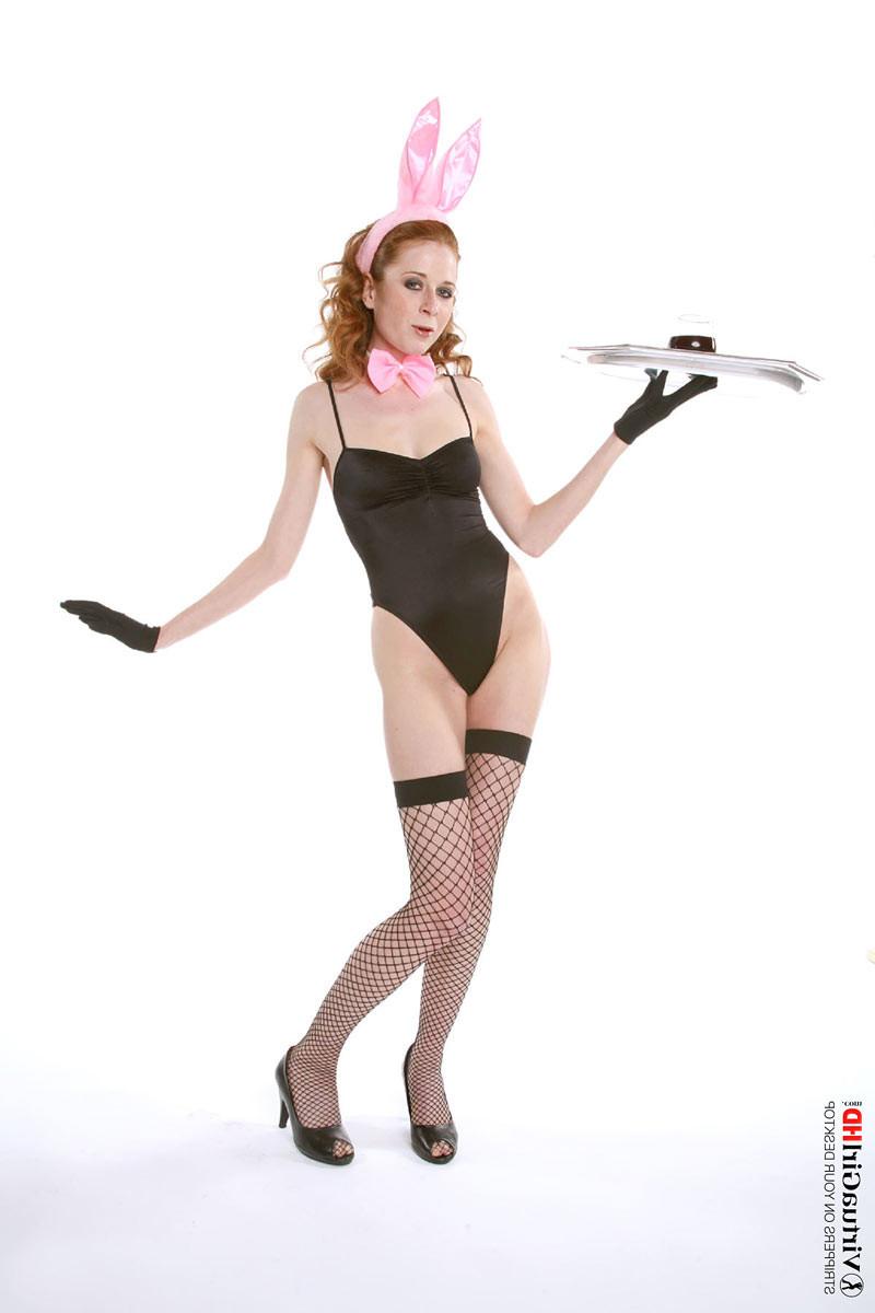 16P Naughty redhead bunny Lucie T strips in fishnets