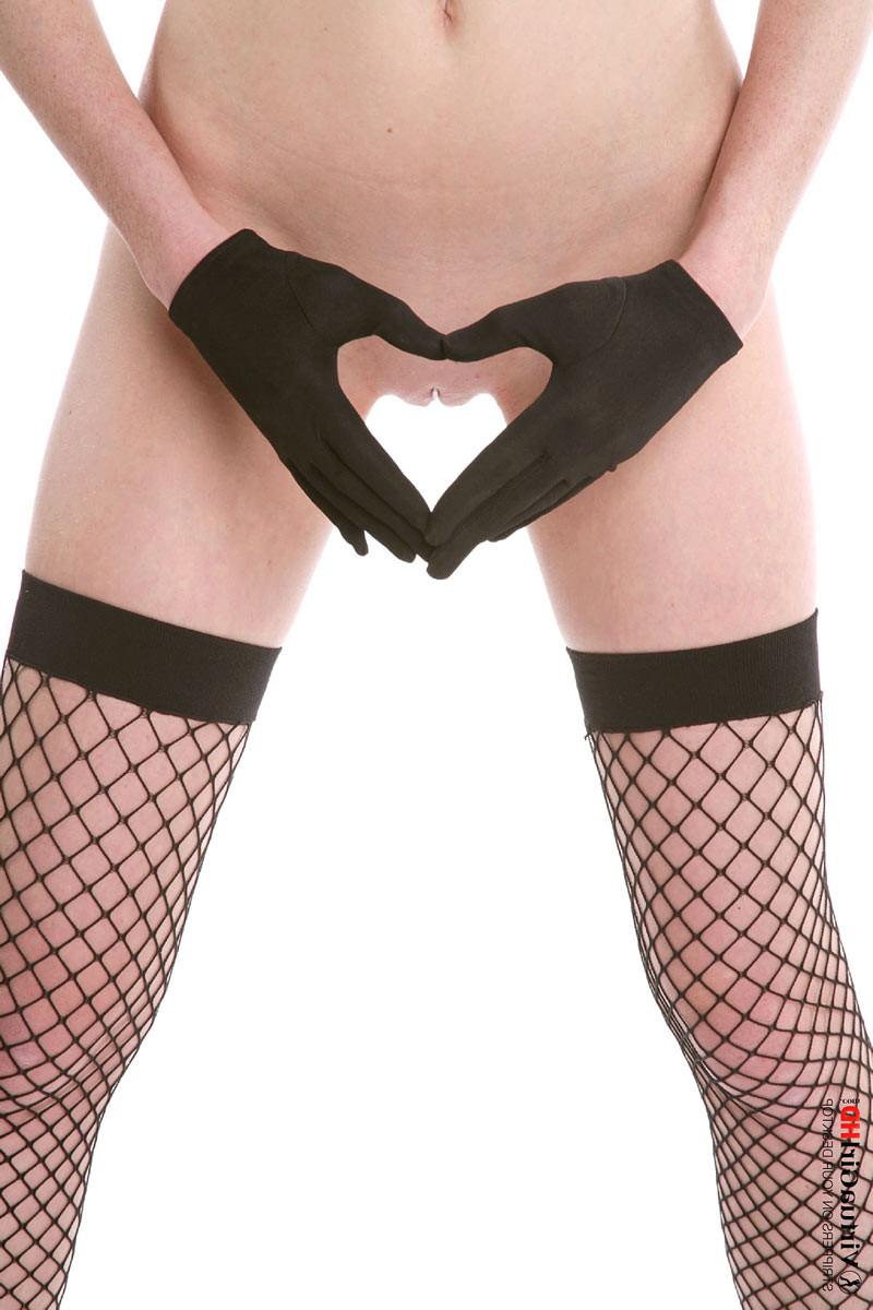 16P Naughty redhead bunny Lucie T strips in fishnets