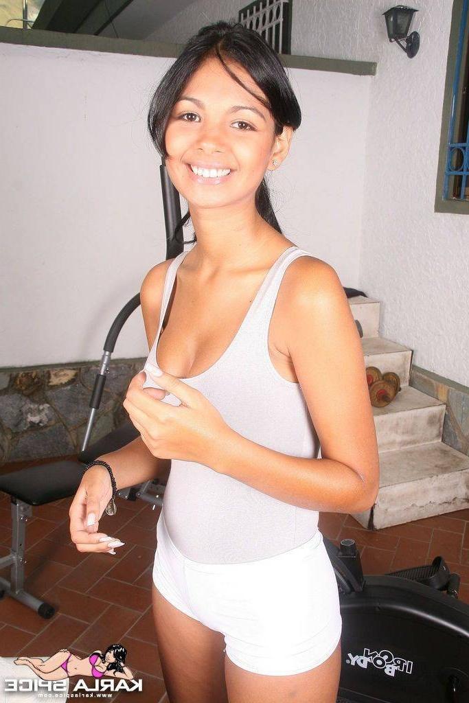 16P Busty latin chick dressed in sexy tracksuit working out in the gym 