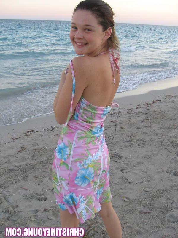 15P Amazing teen Christine Young flashing her tits on the beach