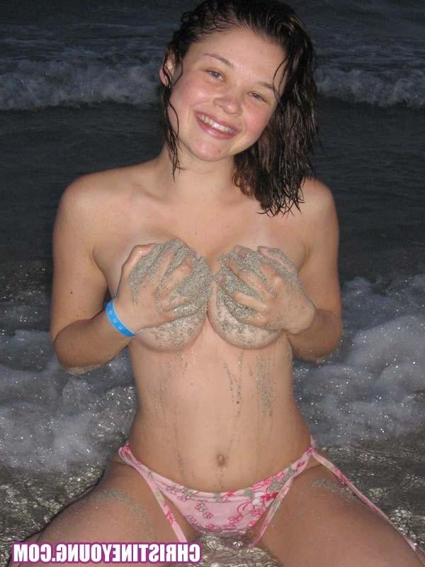 15P Amazing teen Christine Young flashing her tits on the beach