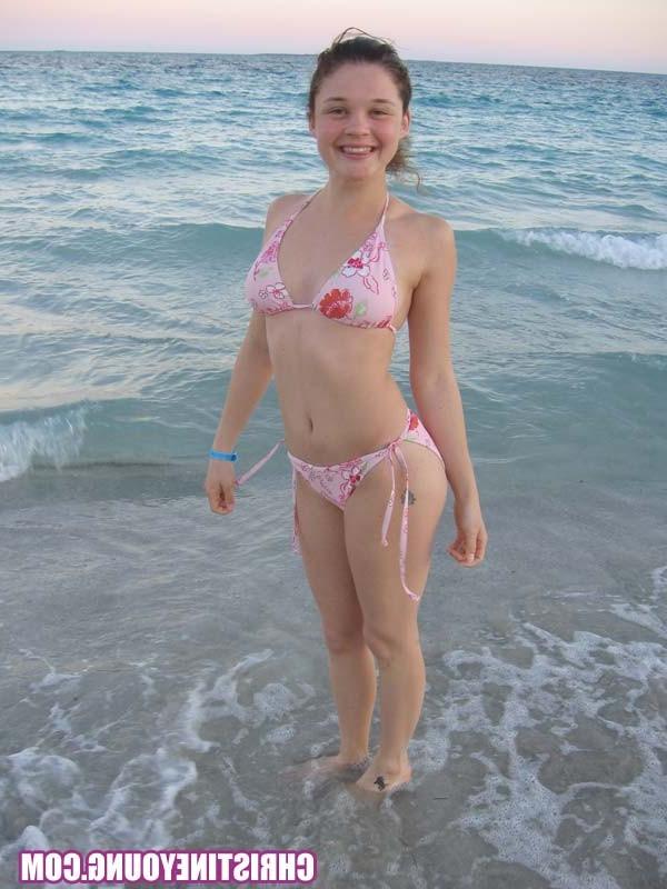 15P Amazing teen Christine Young flashing her tits on the beach