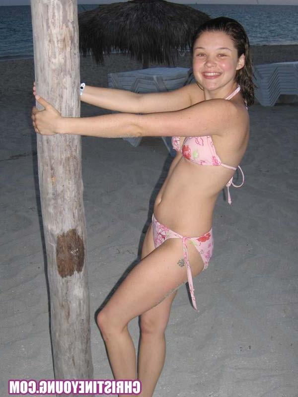 15P Amazing teen Christine Young flashing her tits on the beach