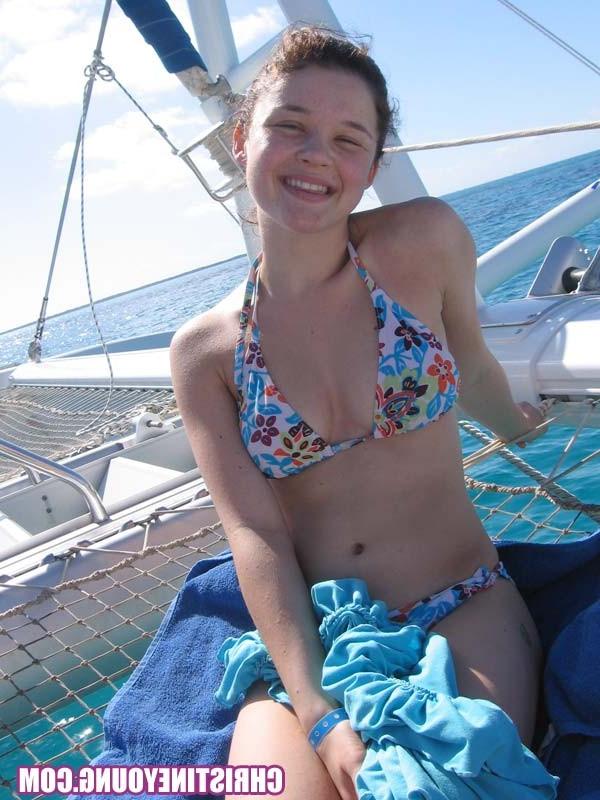 15P Teen cutie Christine Young posing outdoors in the tropics