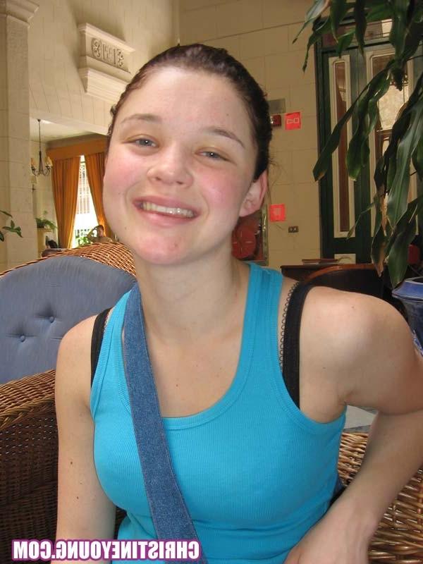 15P Cheerful teen Christine Young poses after dark on the beach