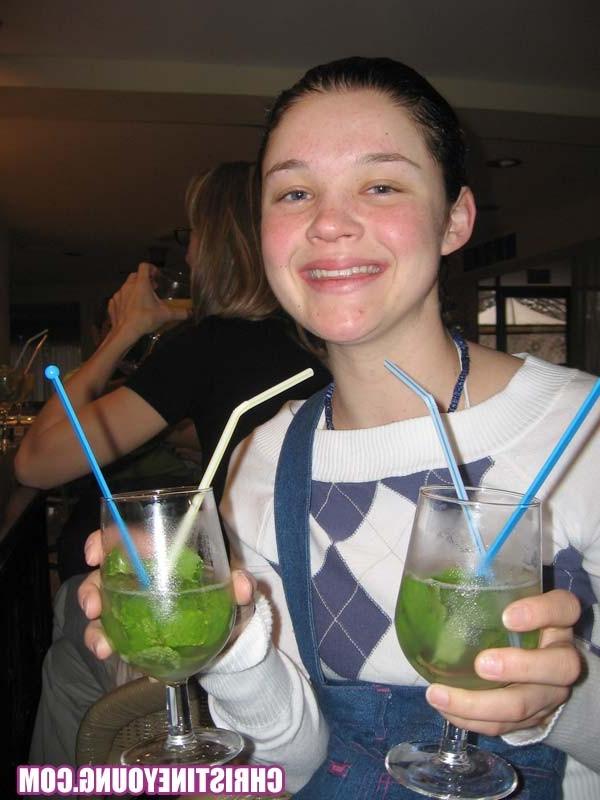 15P Cheerful teen Christine Young poses after dark on the beach