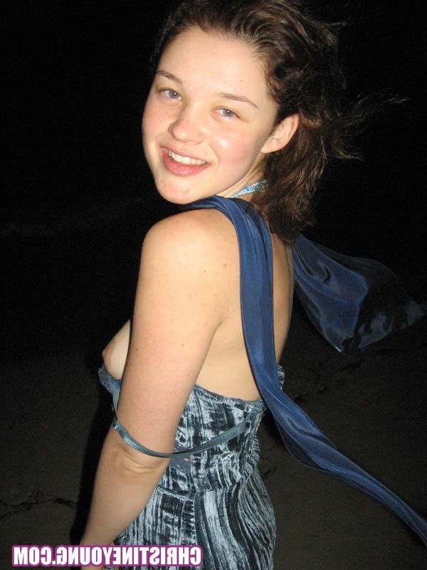 15P Cheerful teen Christine Young poses after dark on the beach
