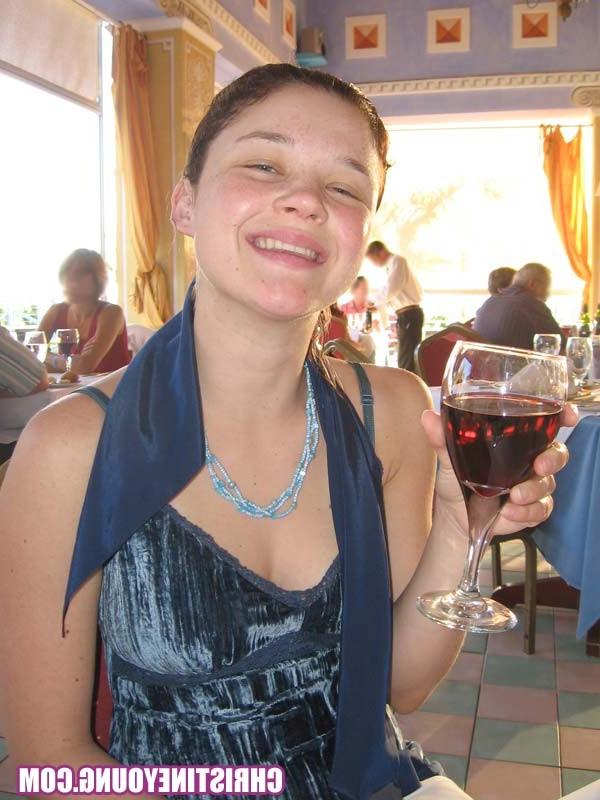 15P Cheerful teen Christine Young poses after dark on the beach