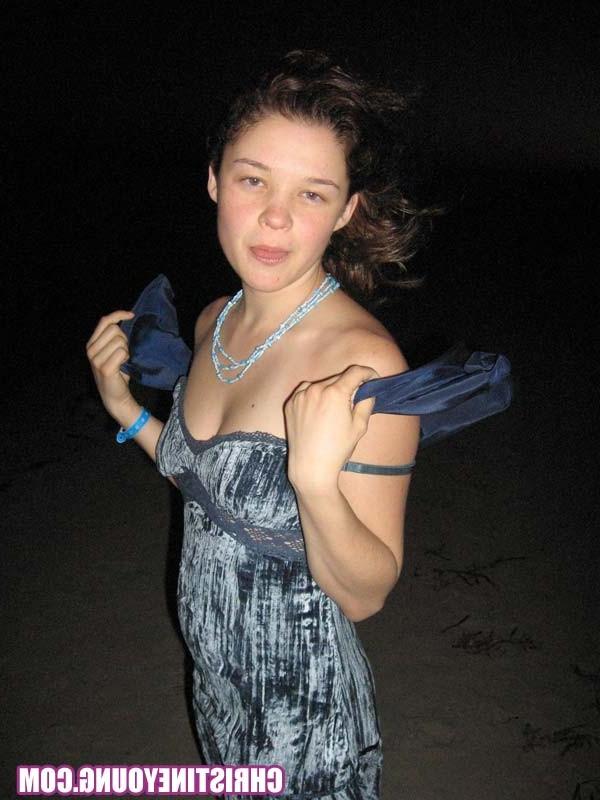 15P Cheerful teen Christine Young poses after dark on the beach