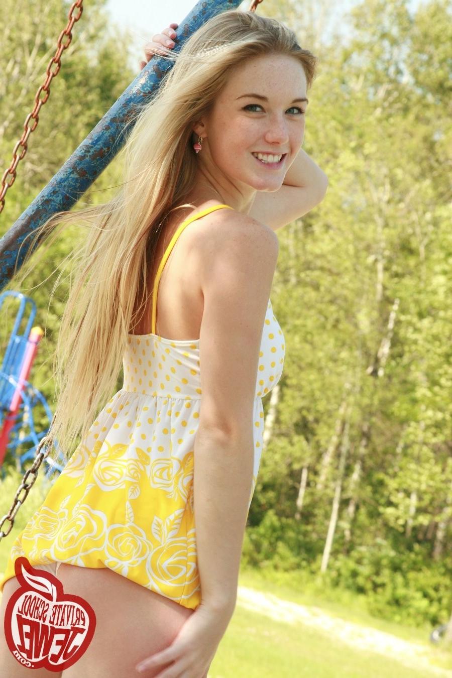 16P Blonde teen with small tits plays on the swings without panties