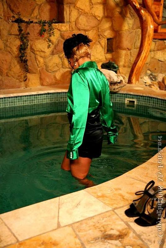 18P Wealthy blonde washes her facial off during a satin soaking swim