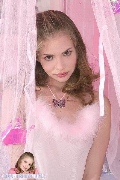 15P Young cute petite blonde teen in lingerie on a bed